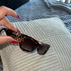 Miu Miu Tortoise Sunglasses with Gold Accents